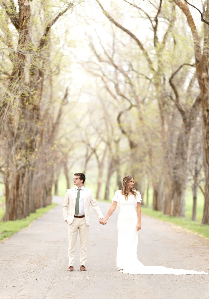 Couple on tree-lined road